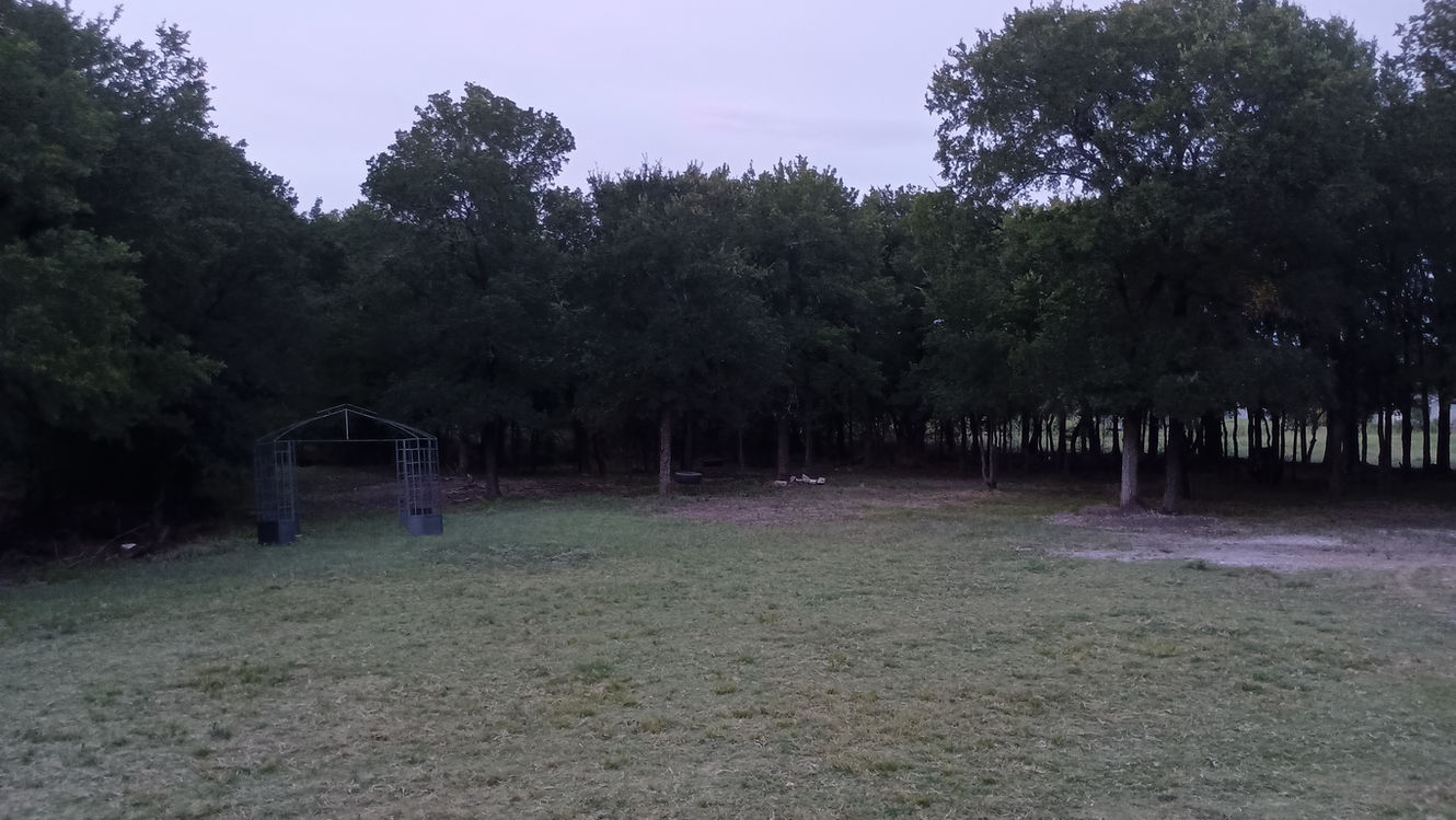 The view from the porch of the house, with a gazebo a few steps away and a huge area for use.