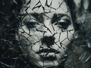 Woman's face in shattered mirror - to be seen fully