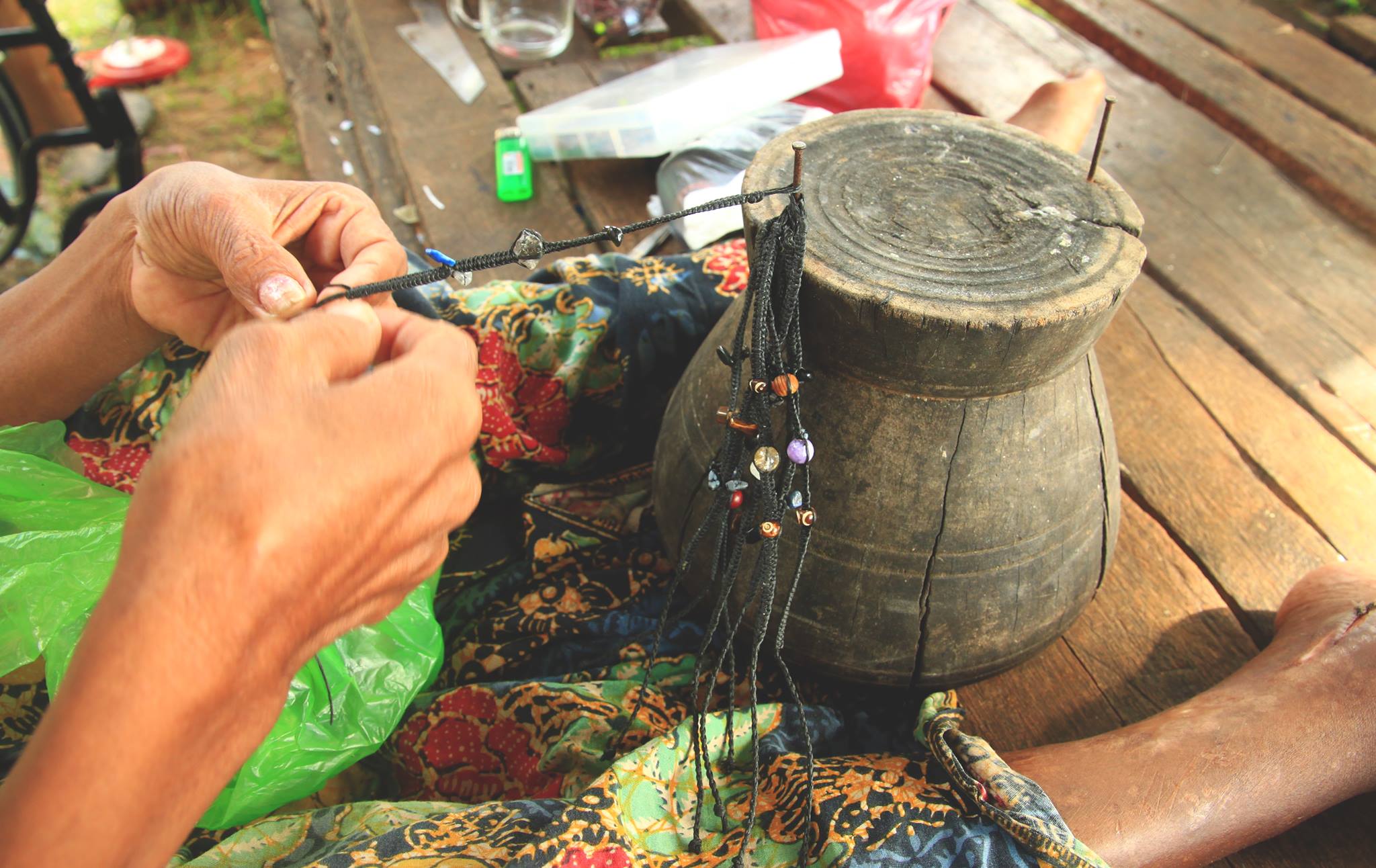 Mrs. Nom making bracelets
