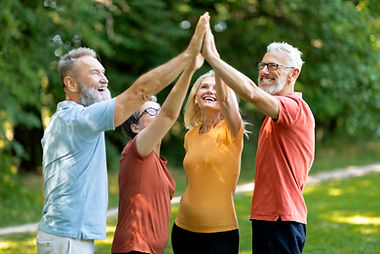 teamwork-concept-group-happy-senior-people-giving-high-five-each-other-outdoors-sporty-old