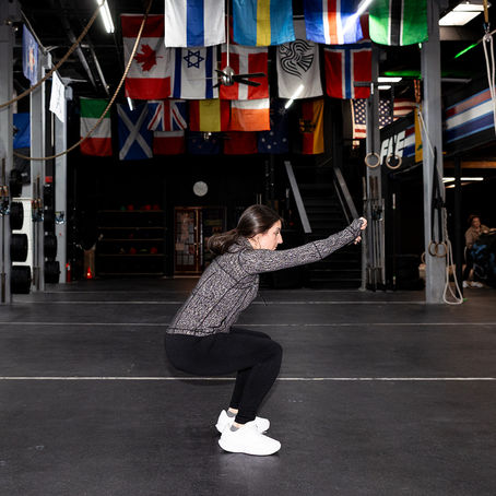 Patient working with a provider during a functional movement assessment at a physical therapy clinic in Philadelphia, PA
