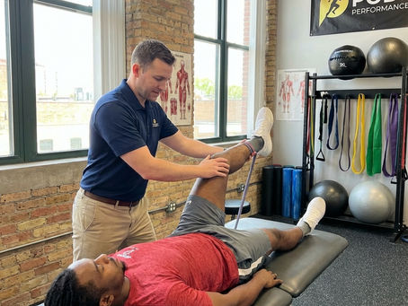 Patient working with a provider at a performance physical therapy clinic in Hanover, MA during one-on-one rehabilitation