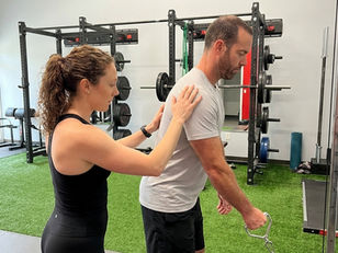 : Patient working with a provider at a performance physical therapy clinic in Mt Pleasant