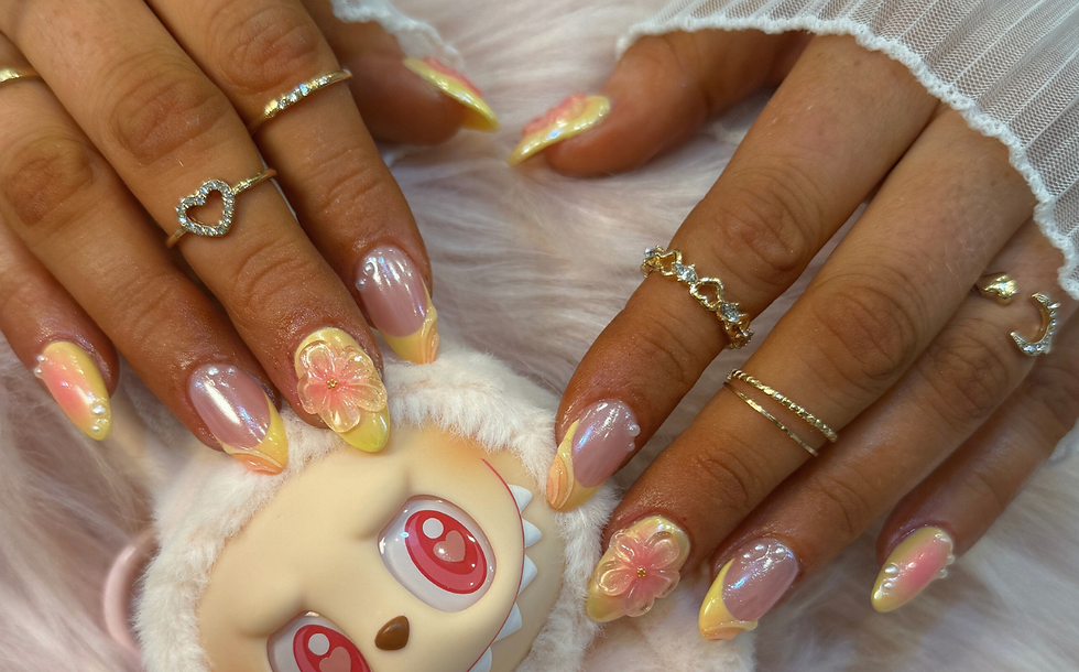A girl showing her nails while holding a teddy bear
