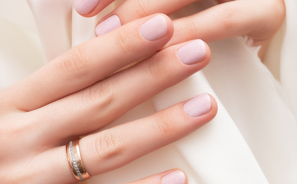 Pink nail design. female hands with glitter manicure
