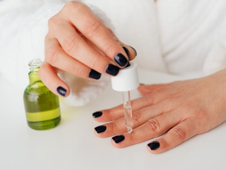 Person Applying Serum on Her Finger