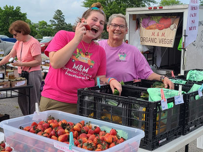 farmer selling strawberries