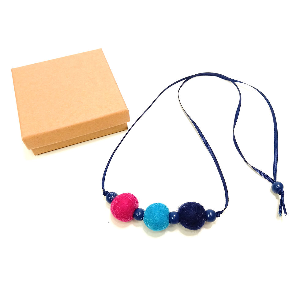Thumbnail: Wool felt bead necklace in pink, turquoise, and navy with blue wooden beads and blue ribbon with kraft card gift box