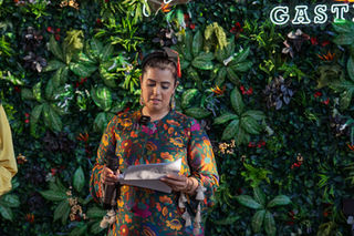 Dipna Anand delivering a speech during her doctorate celebration at The Brilliant Gastro by Dipna Anand in Southall, photographed by RH Photography.