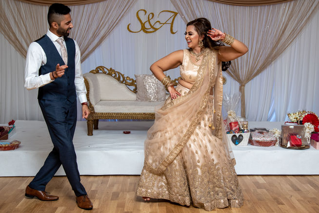 Couple dancing joyfully at S & A celebration