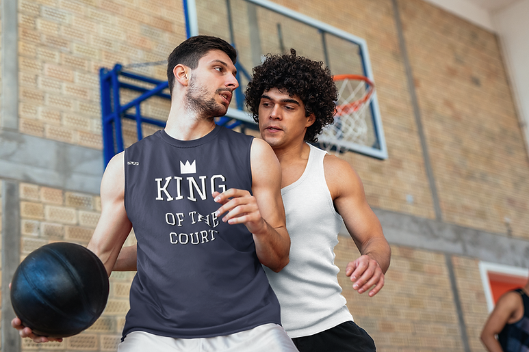 a man playing basketball against another man with his back facing the basket