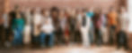 Group of diverse people standing in front of a brick wall.jpg