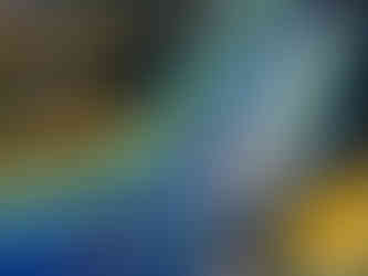 3 people sliding on a water slide