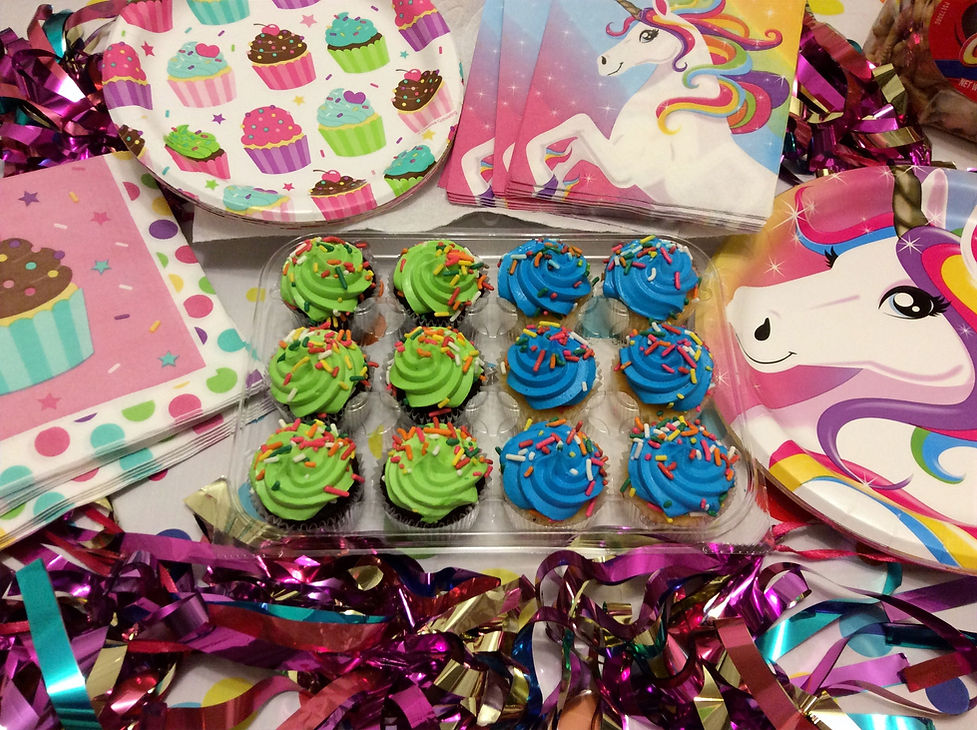 Party time eating green and blue cupcakes for littles at the Little Baby Boo Nursery