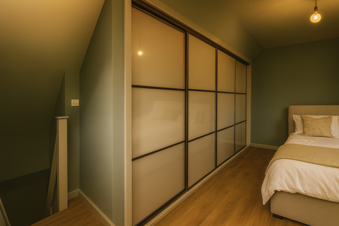 Sliding doors with cashmere glass and black frames