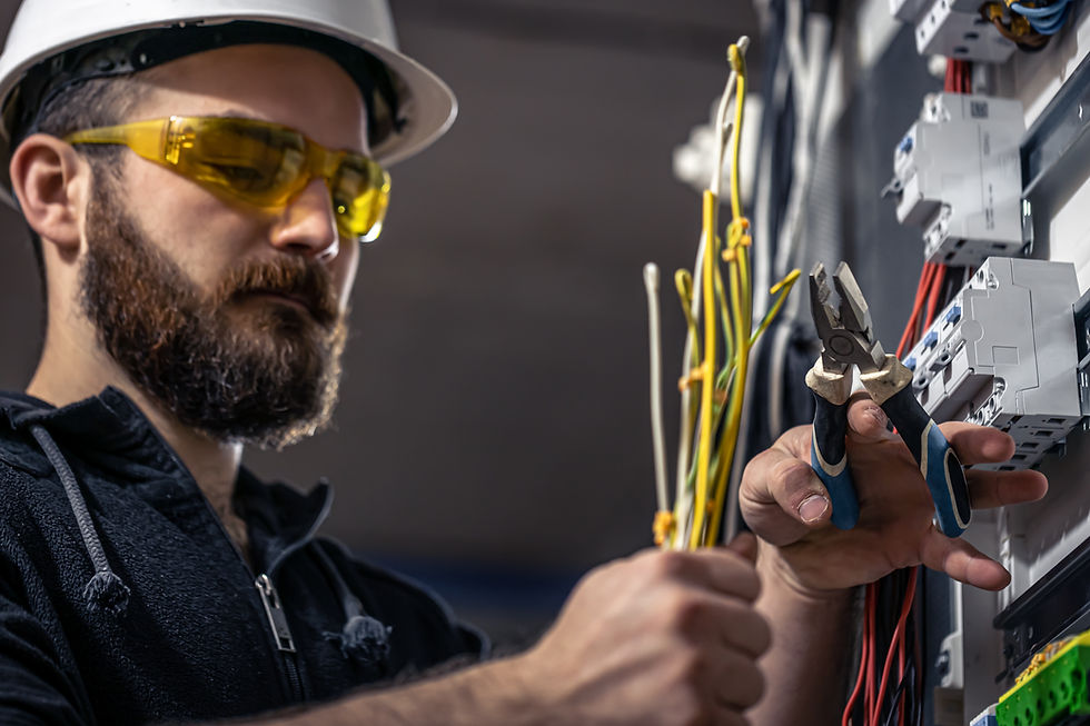 male-electrician-works-switchboard-with-electrical-connecting-cable.jpg