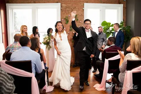 Elegant wedding celebration at The Woolworth Dallas, TX – newlyweds and guests enjoying a beautifully decorated reception in the restaurant’s chic dining area.