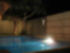 pool lighting outside a family house