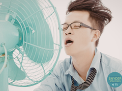 man in front of fan