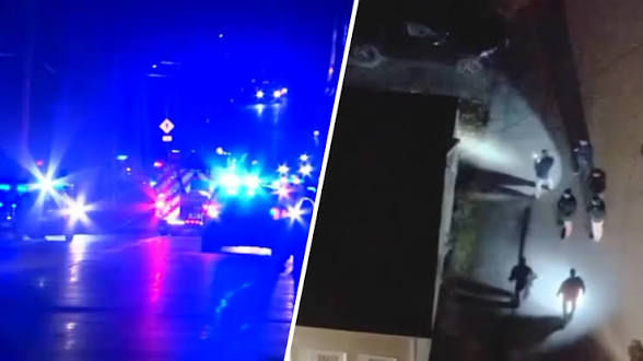 Eye-level view of Canton town center street with emergency vehicles parked