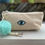 Thumbnail: Sol Teal & Tan  "Evil eye"  vegan leather clutch with Pom Pom