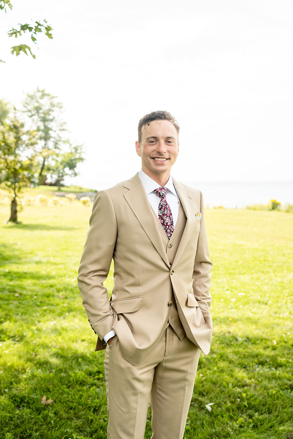 Dan opted for a tan suit and floral tie