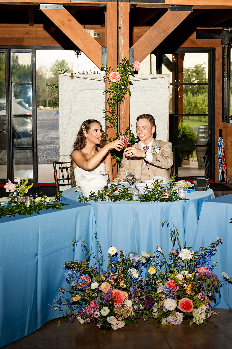 A last minute shift to an indoor ceremony meant we were lacking an arbor to decorate. A quick pivot to some low meadow style grounded arrangements made the ceremony space seem special and intentional.