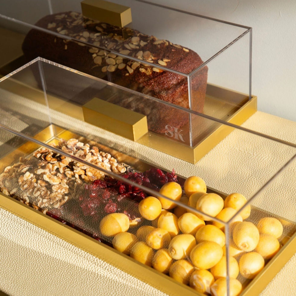 Thumbnail: Empty clear acrylic rectangular cake box with gold base and handle details
