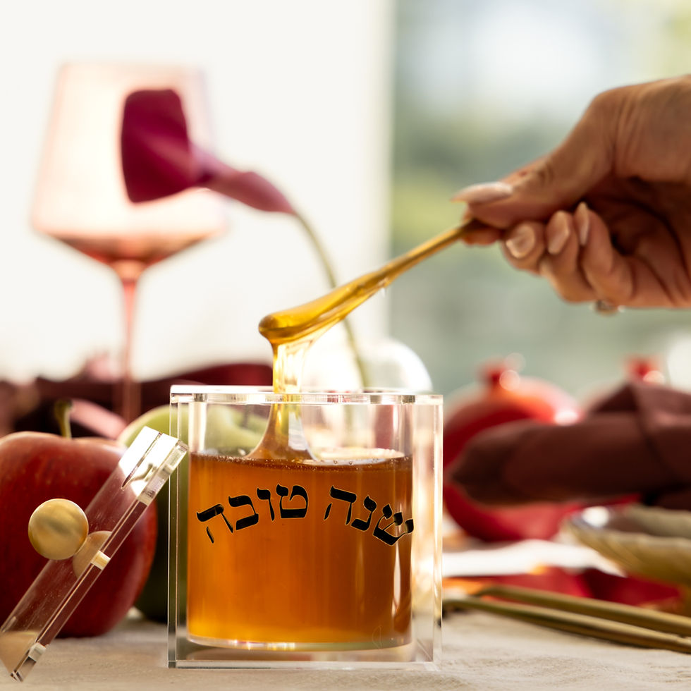 Close view of the crescent-inspired design on the clear Shana Tova honey jar