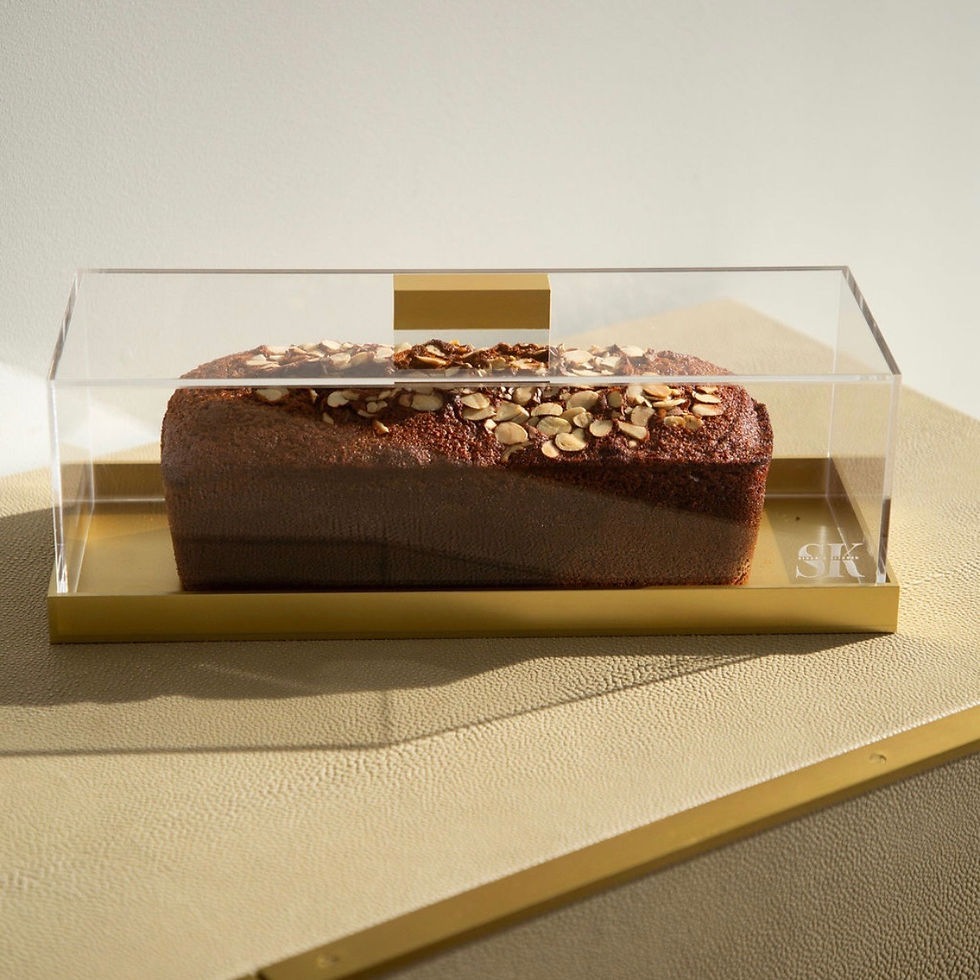 Clear acrylic Gold Original Versatile Cake Box displaying a loaf of honey cake