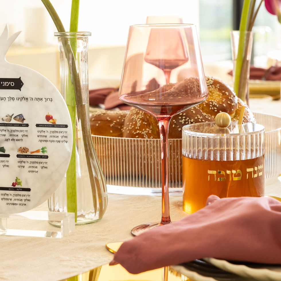Thumbnail: Close view of the illustrated Rosh Hashanah simanim blessings on a marble pomegranate centerpiece