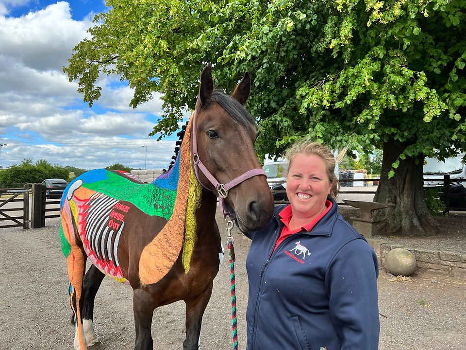 Gillian Higgins of Horses Inside Out with an anatomically painted horse for lecture demonstration