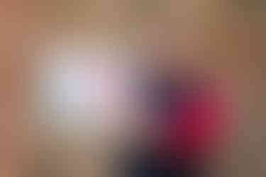 Gillian HIggins holder her book Exploring Equine Anatomy to illustrate the size of this lovely mindfulness equine anatomy colouring book