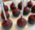 Cake pops with chocolate frosting and red sprinkles