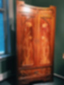 Wooden cabinet with floral ornaments