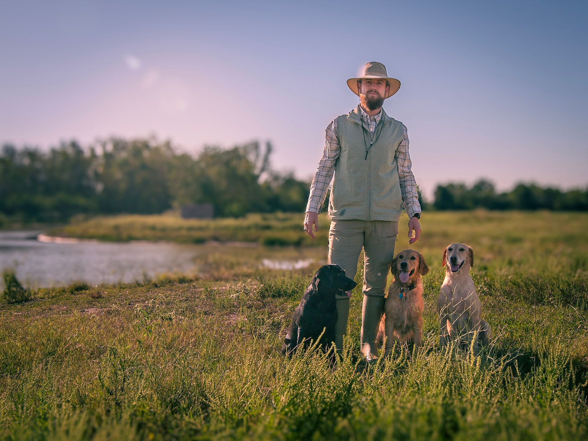 Portrait of owner and his dogs outdoors near Sugar Land TX 