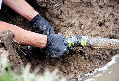 Man Holding Pipe