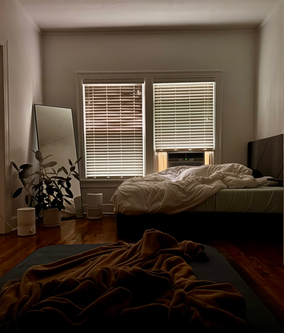 Dim bedroom at Aaron's apartment