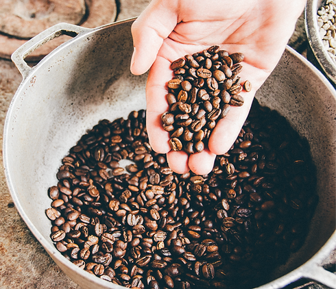 coffee beans on gray steel wok_edited.png