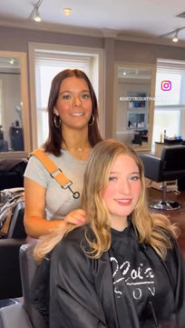 Hair stylist working with client at DeCola Salon in Chester County Pennsylvania, salon career setting