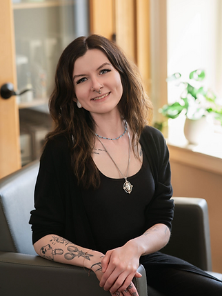 Michaela Evans, DeCola Salon.png