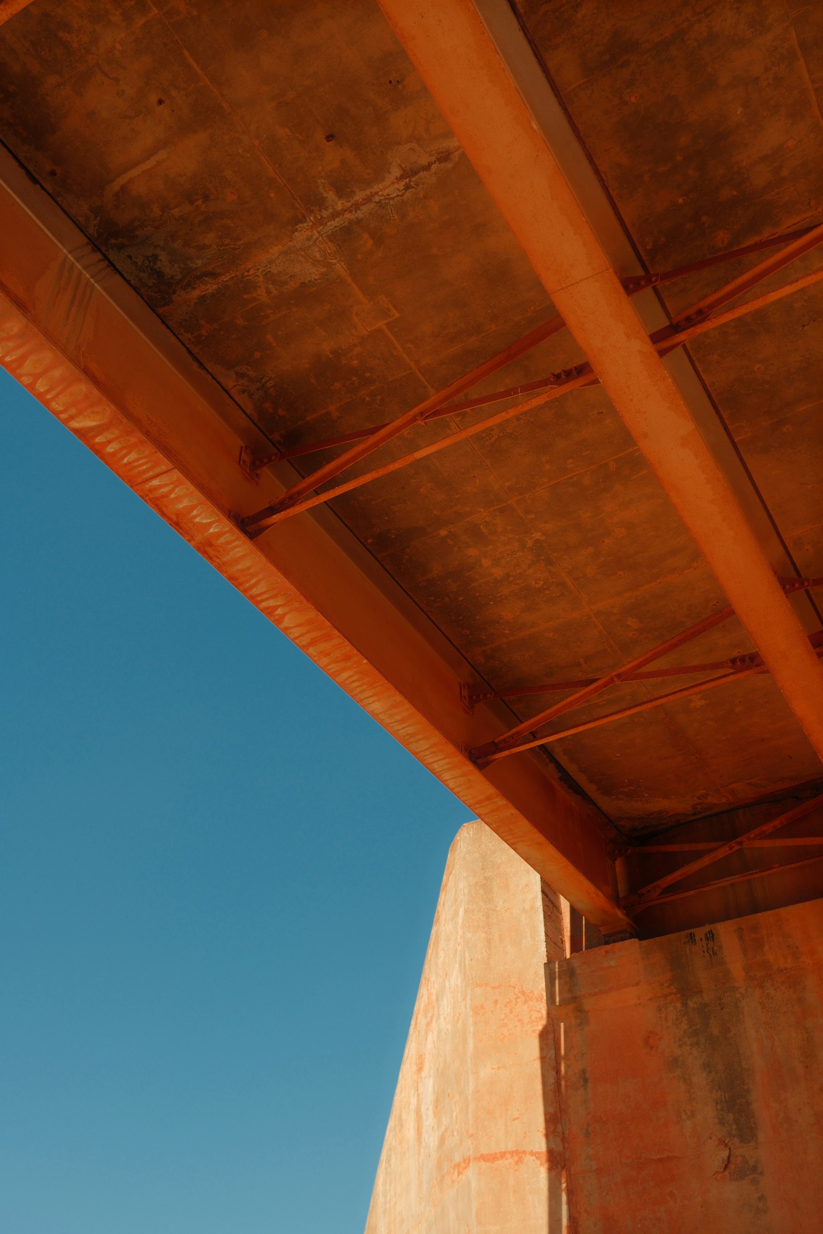 Underside of a steel bridge with exposed girders