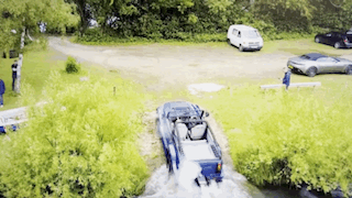 The WaterCar moving from open water directly onto the land.