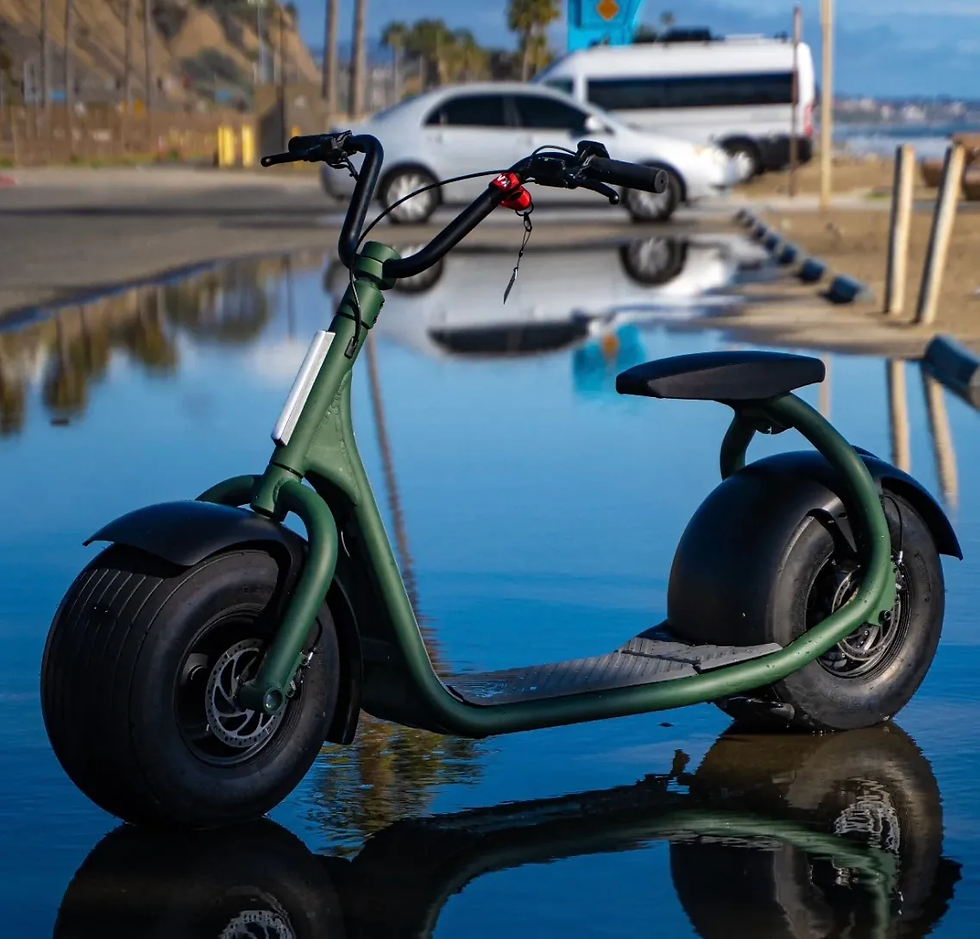 A parked green KaaSpeed K1 electric scooter in a wet parking lot