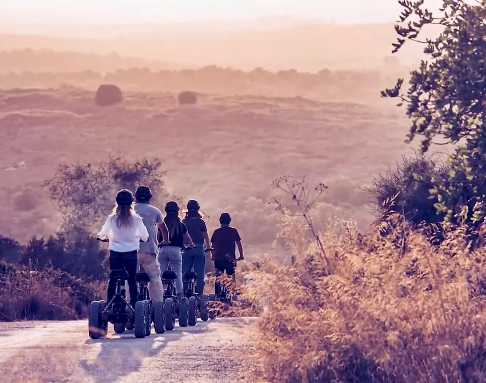 Several EZRaider LW riders touring a countryside 
