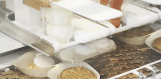 A visual of the toppings being applied at a later stage.