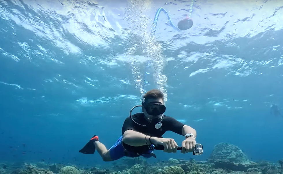 A free diver exploring the ocean floor using the AirBuddy system