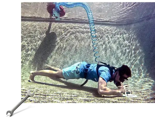 A diver using the Airbuddy tankless dive system on an underwater repair