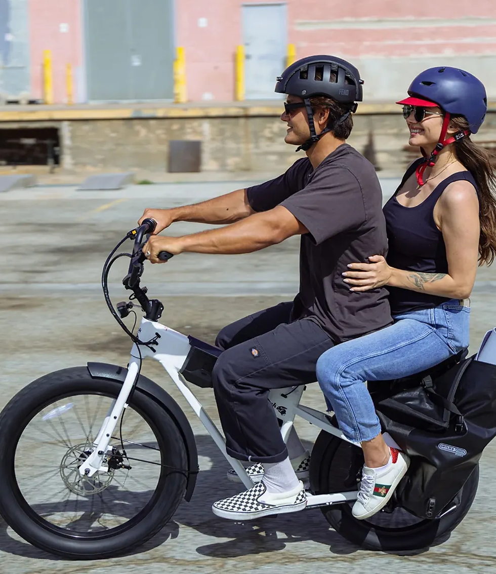 A view of two riders on a silver JackRabbit MG Doble electric bike