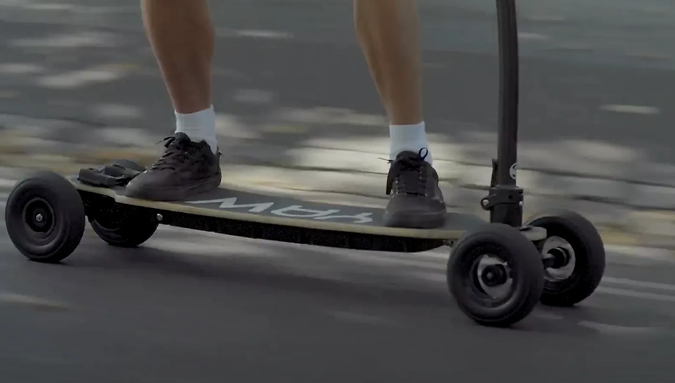 A close look at someone cruising on a Yawboard electric skateboard. 